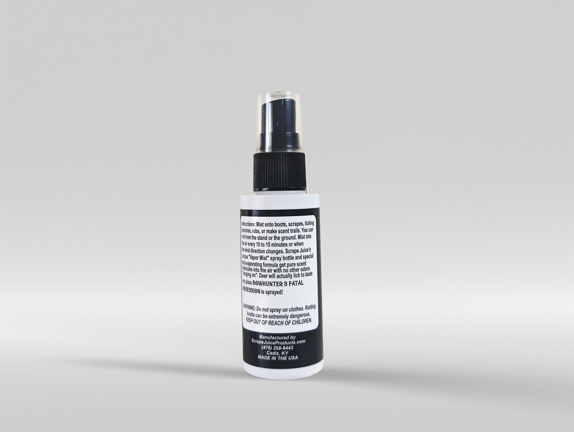 Bowhunter's Fatal Obsession Deer Lure / Deer Scrape 2 FL OZ Back View Without Product Card Image Of Whitetail Buck Smelling Scrape Juice Bottle In Tree