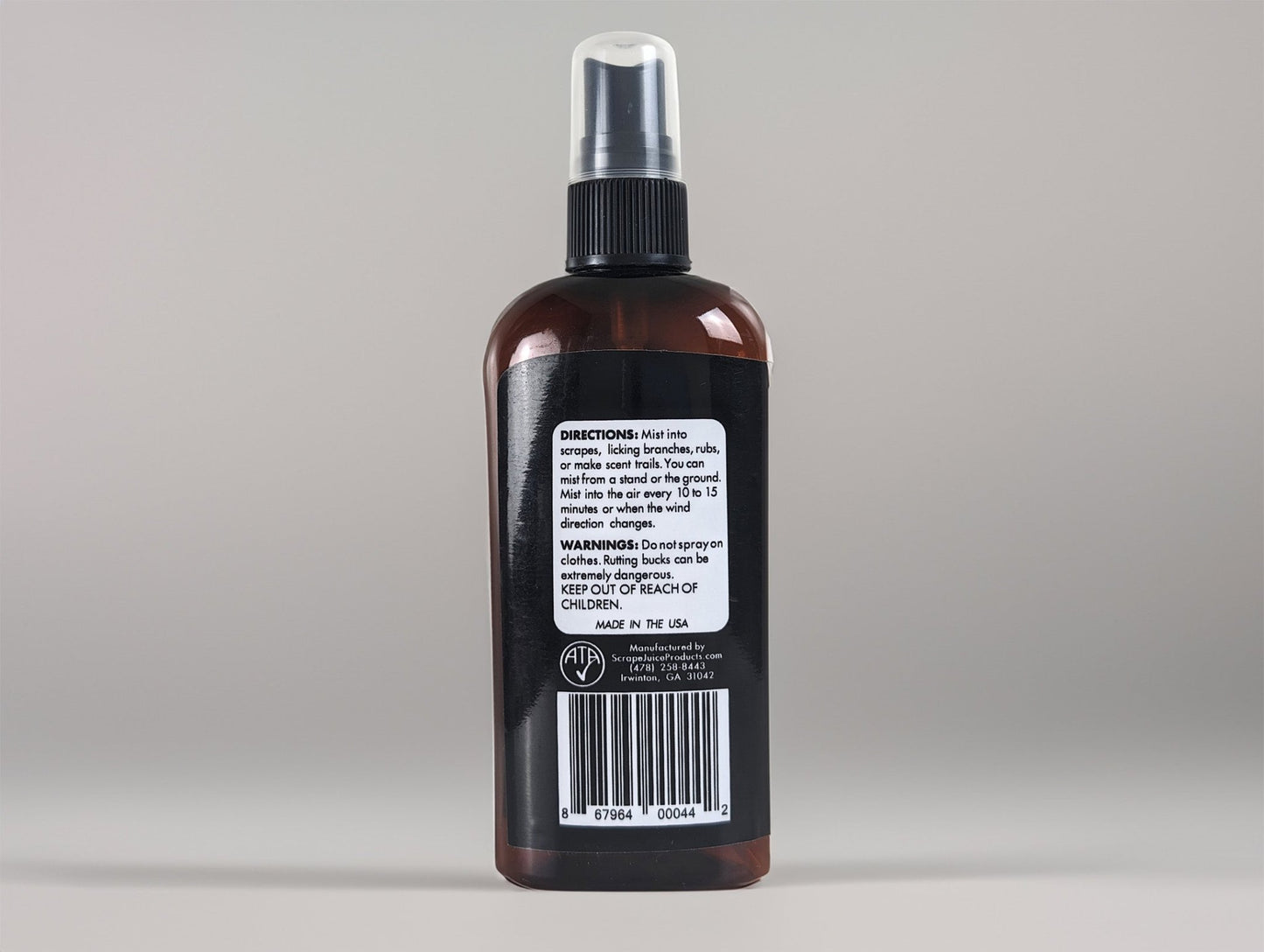 Bowhunter's Fatal Obsession Deer Lure / Deer Scrape 4 FL OZ Back View Without Product Card Image Of Whitetail Buck Smelling Scrape Juice Bottle In Tree