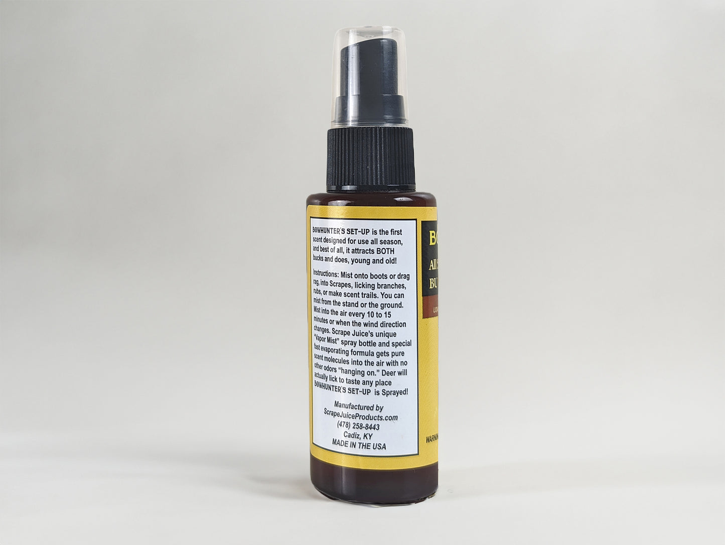Bowhunter's Set-Up Deer Lure / Deer Scrape 2 FL OZ Back View Without Product Card Image Of Whitetail Buck Smelling Scrape Juice Bottle In Tree