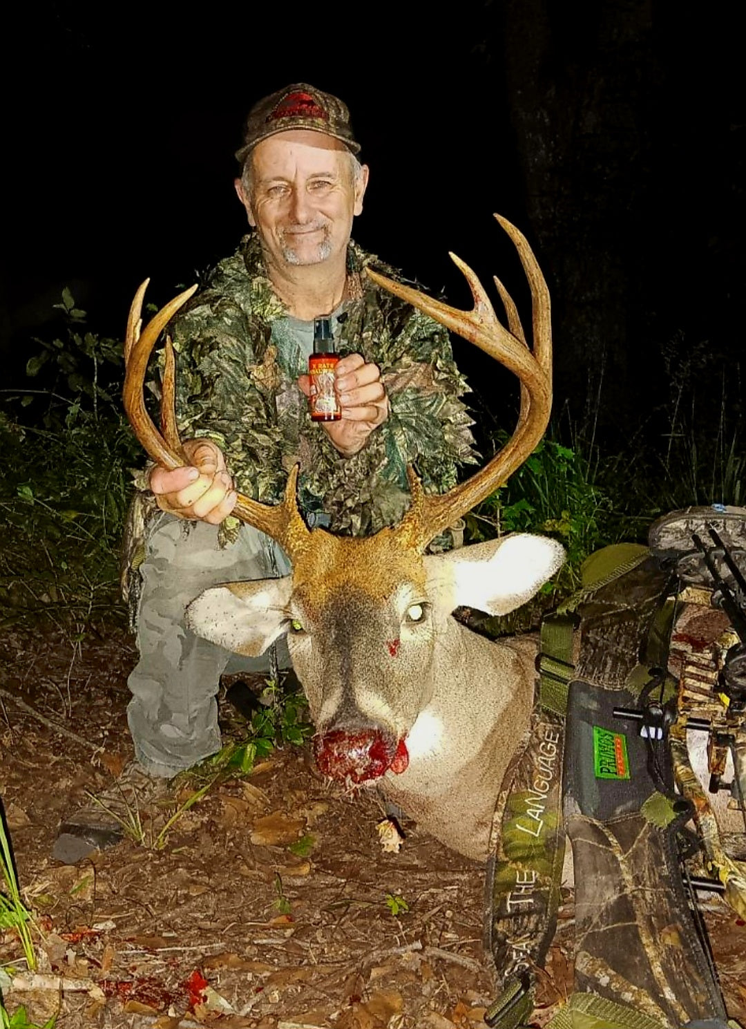 Man with Whitetail Buck Trophy Scrape Juice 2024 Best Lure X-Rate Tarsal Juices