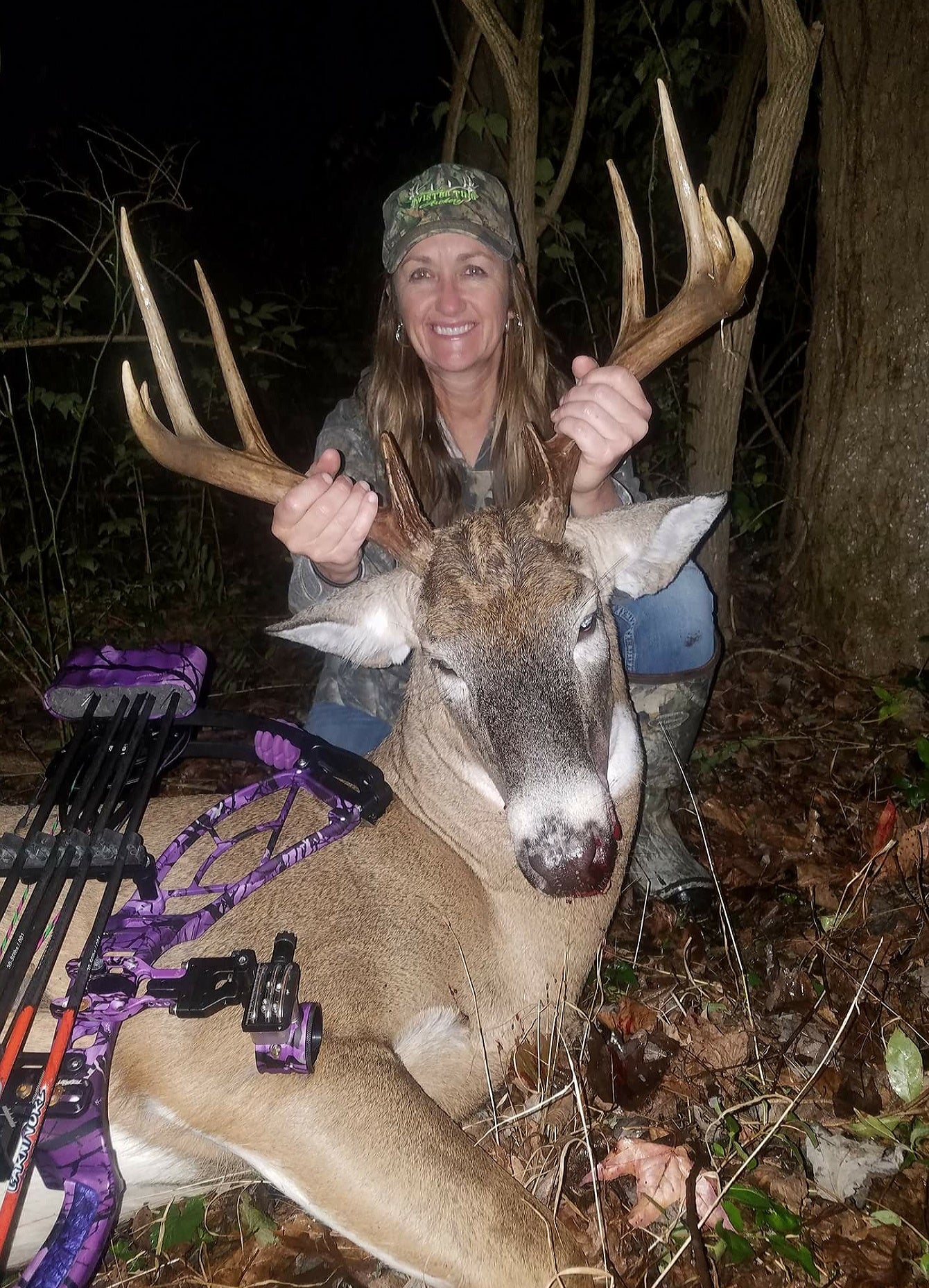 Woman with Trophy Whitetail Buck using Top 2024 Scrape Juice Bowhunter's Fatal Obsession Deer Lure